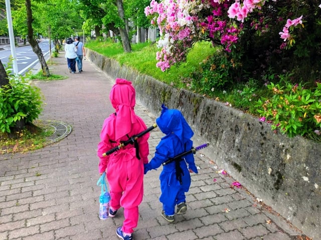 Children in full ninja costume enjoying Ninja City