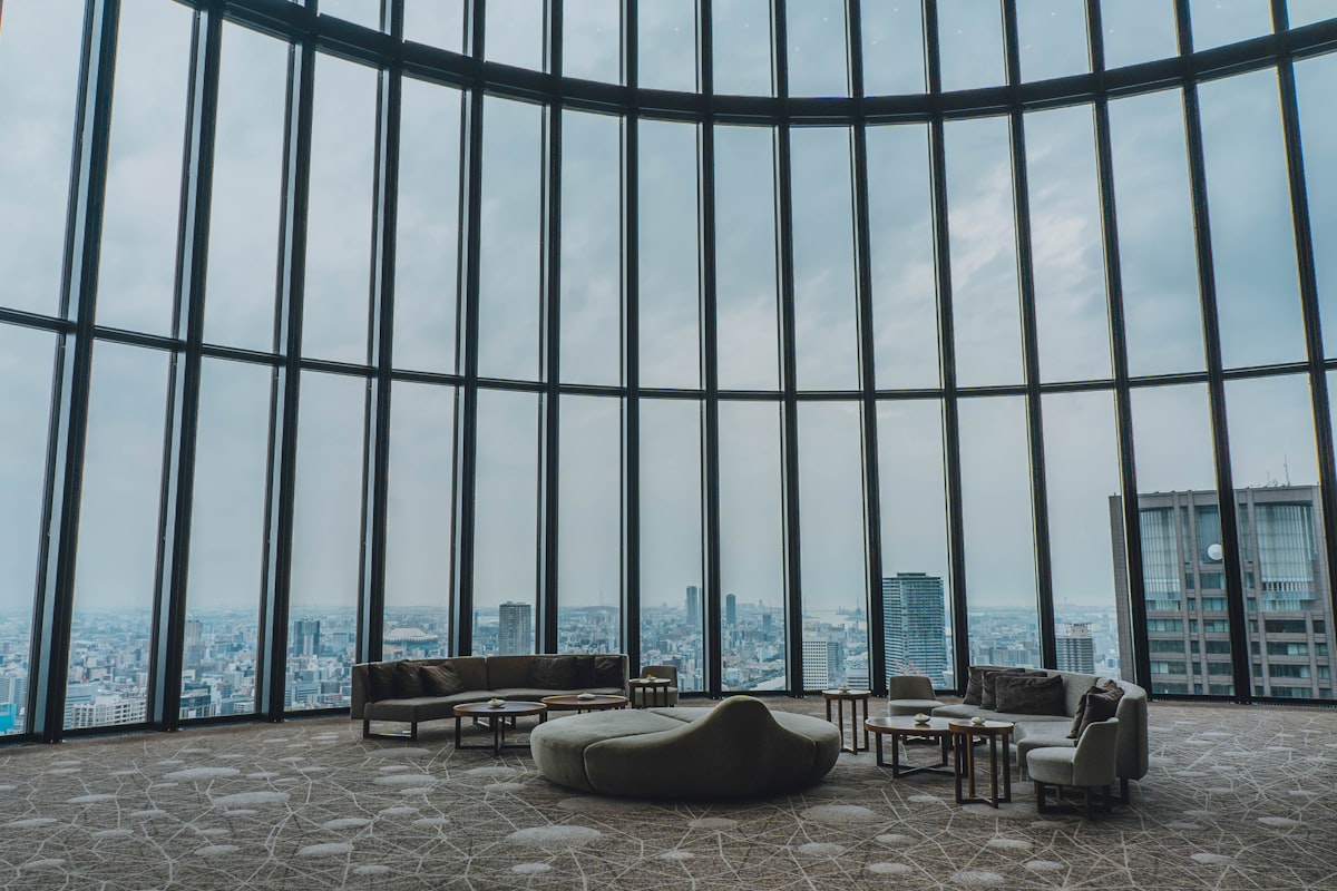 A spacious luxury hotel room at Conrad Osaka with floor-to-ceiling windows