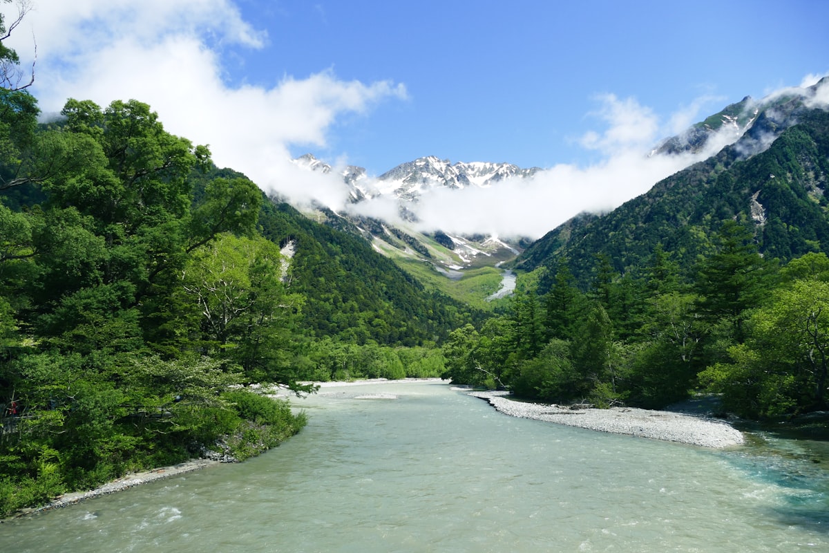 A clear blue alpine river flowing through Kamikochi national park in the Japanese Alps