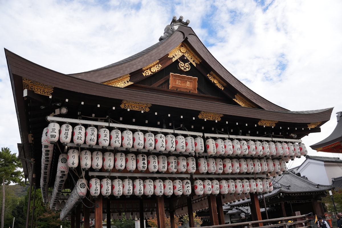 Rows of glowing white lanterns at Yasaka Shrine in Kyoto's Gion district at night