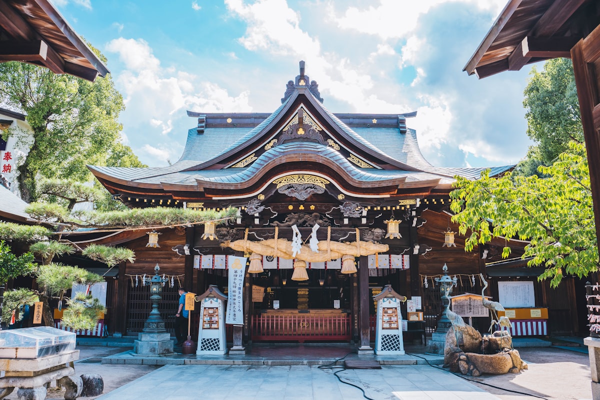 Kushida Shrine in Fukuoka with traditional wooden architecture under cloudy skies