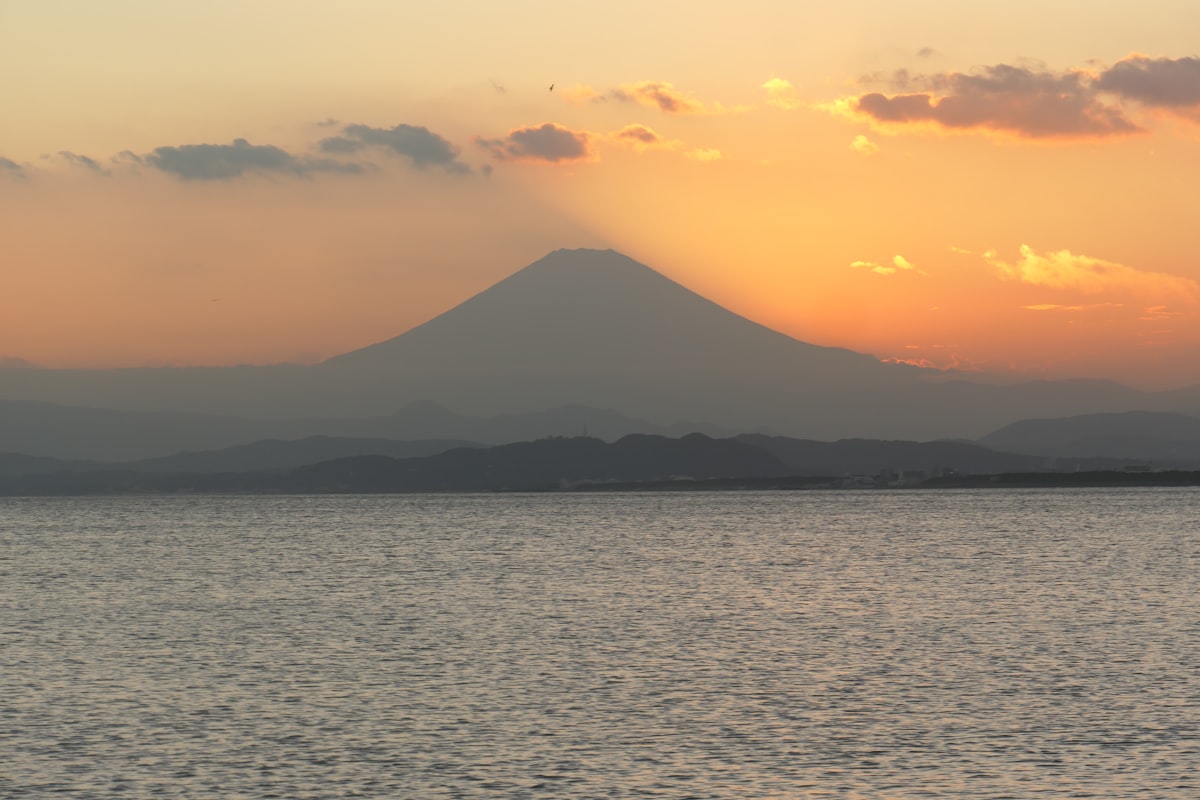 Sunset over Mount Fuji visible across Sagami Bay from Yuigahama beach in Kamakura