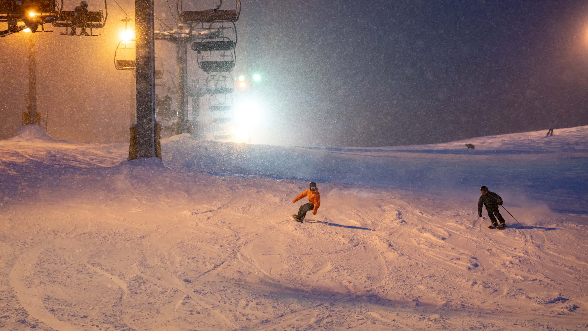 Floodlit ski slopes and chairlift at Furano after dark