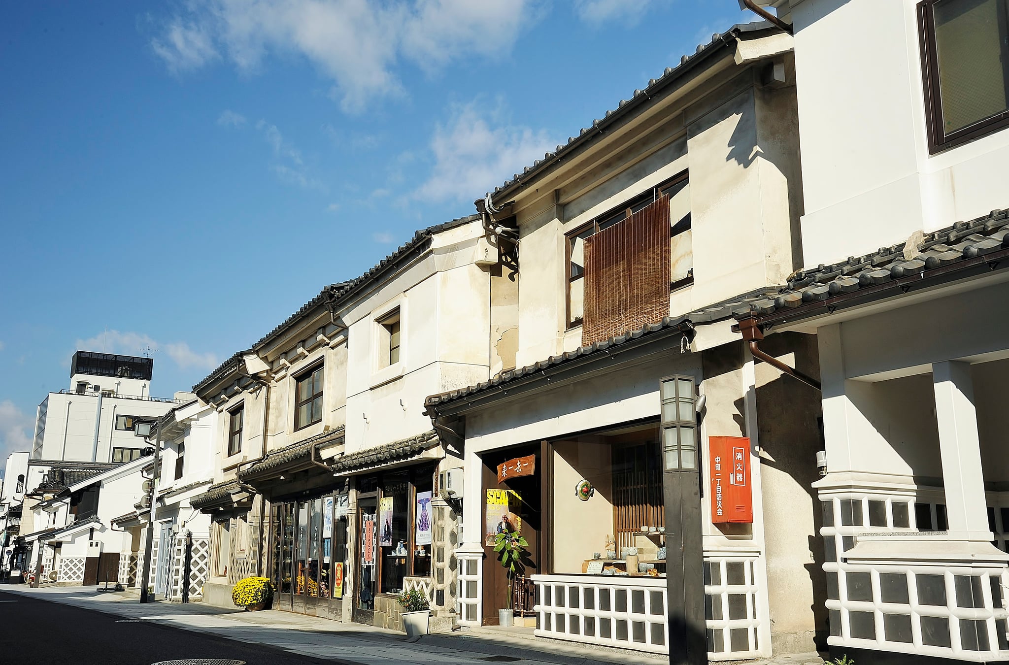 Traditional white-plaster shopfronts along Nakamachi in Matsumoto